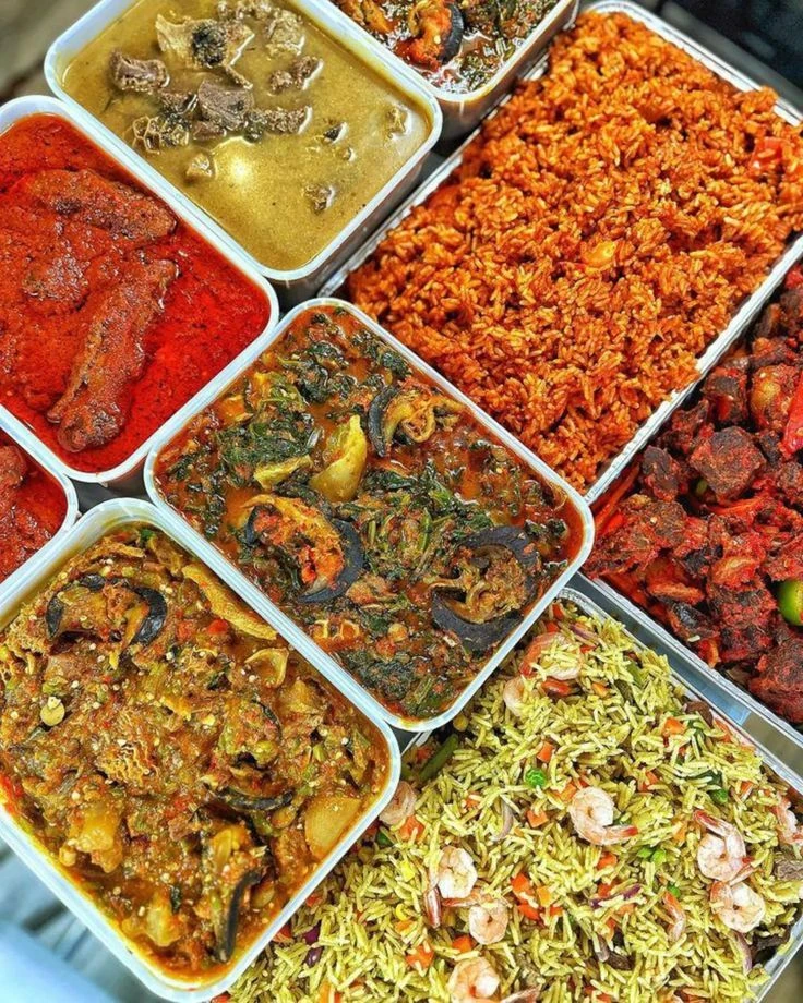 Serving trays of Nigerian rice dishes, stew and soup